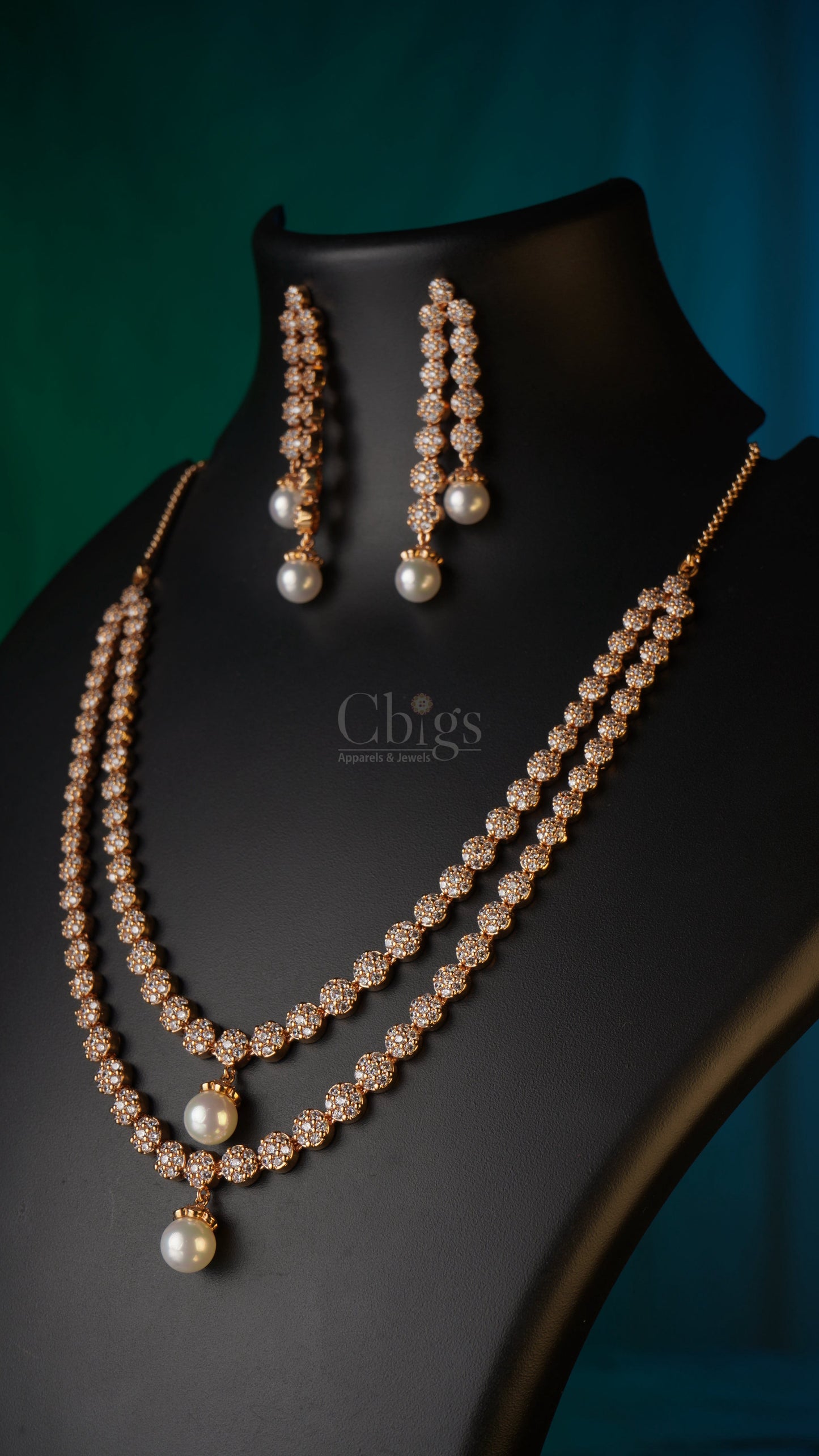 Pearl earring on a black stand against a dark green background